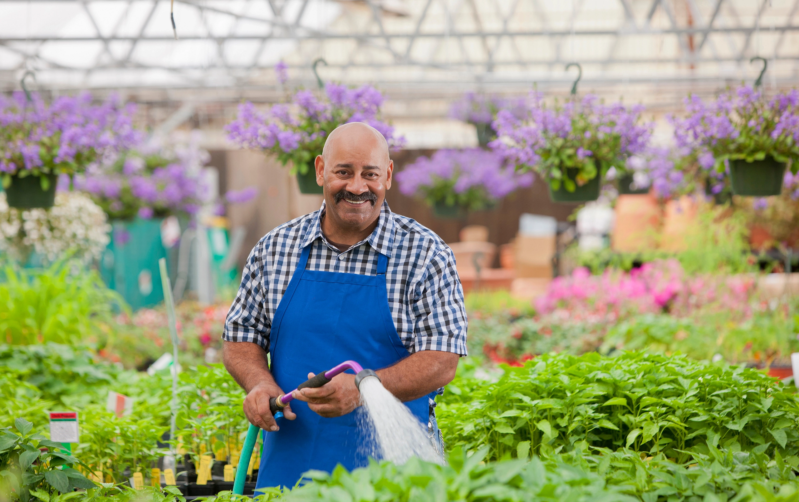 Retail ROI Playbook - retail worker in garden center